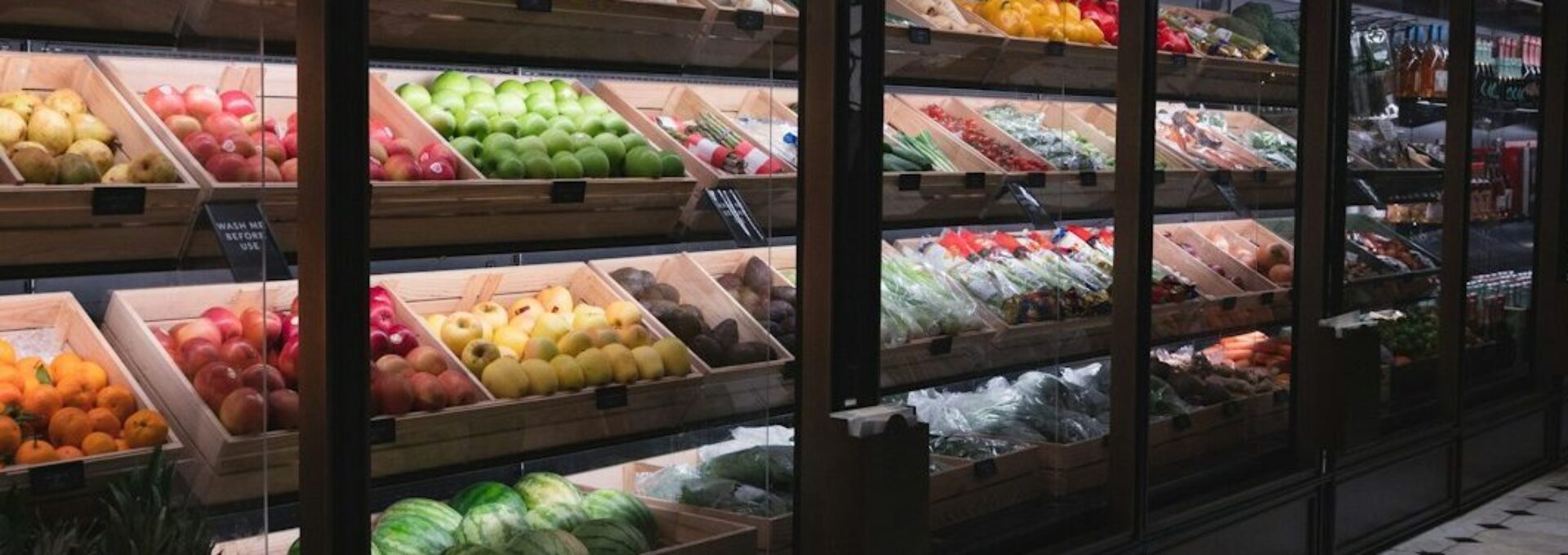 a display in a grocery store filled with lots of fruit